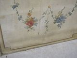 a painting on the wall of a room with flowers painted on it