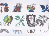 a lot of drawings on the wall of a room