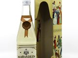 an image of a bottle of liquor next to a cardboard box
