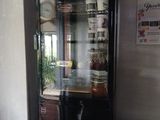 a black counter top with a glass display case on it
