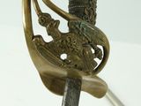 a close up of a sword with a bird on it