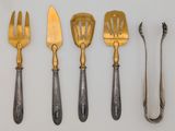 four different types of silverware including forks, spoons and knives