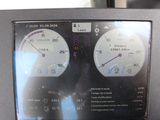 a picture of a car dashboard with two gauges on it