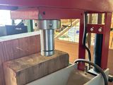 a picture of a machine that is working on a piece of wood