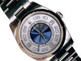 a silver watch with a blue face on a bracelet