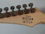 a close up of a guitar neck with six knobs
