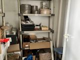 a room that has a shelf with many items on it