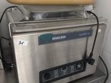 stainless steel counter top with a pan on top of it and a pan on top of it