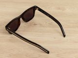 the sunglasses are on the table ready to be worn