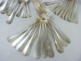 several silver spoons and spoon spoons on a white surface
