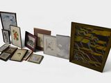 many framed pictures on a white surface with a white background