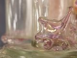 a close up of a glass object on a plate