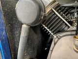 a close up view of a motorcycle engine in a garage