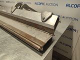 a close up of a piece of metal with a hammer on it