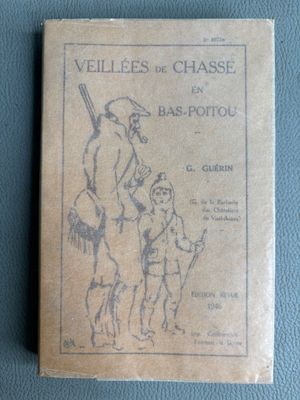 an old book sitting on top of a blue table next to a wall