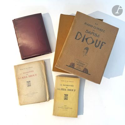 several old books are sitting on a white surface next to each other