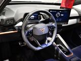 a steering wheel and dashboard of a car with a touch screen