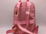 a close up of a pink backpack on a white background
