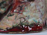 a close up of a ceramic sculpture of a dog