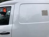 a white van with a sticker on the side of it