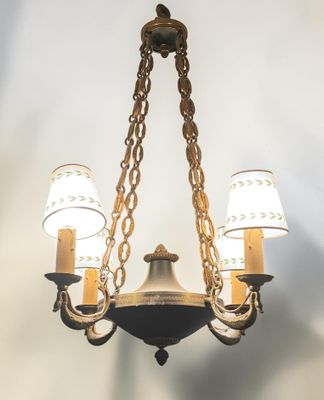 an image of a chandelier with three lights hanging from it