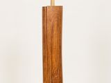 a wooden toothbrush holder with a toothbrush sticking out of it