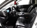 the interior of a car with black leather seats and a steering wheel
