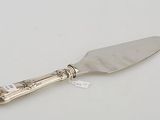 an antique silver plated cake knife with a silver handle