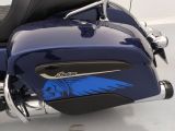 a close up of a motorcycle with a blue decal on it