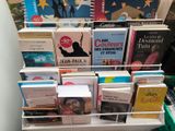 a lot of books that are on a table