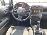 a picture of a car dashboard with a steering wheel