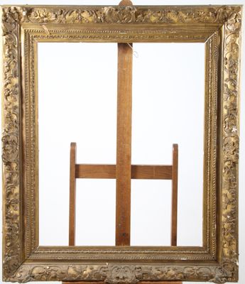 an old wooden easel with a mirror on top of it