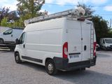 a white van that is parked in a parking lot