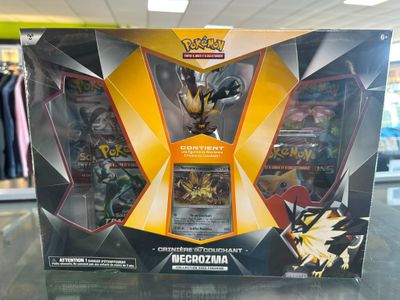 the box of the pokemon card game is open and ready to be played