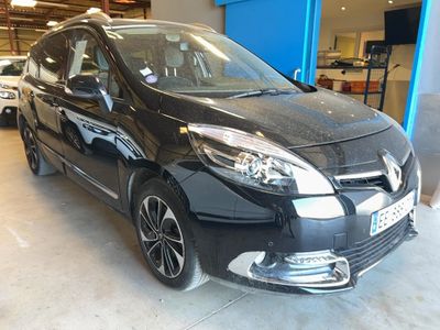 a picture of a black car parked in a showroom