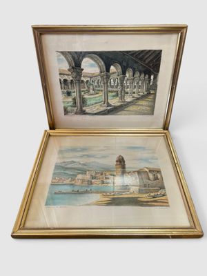 two framed paintings of a view of a city with a fountain