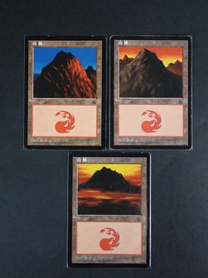 three cards with a picture of a mountain in the middle of them