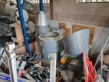 a pile of assorted metal items in a room