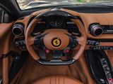 the interior of a sports car with a steering wheel and dashboard