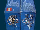 two boxes of legos sitting on top of each other
