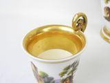 a cup with a handle that is sitting on a table