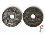 a close up of two coins on a white surface