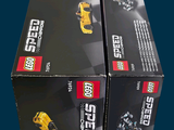 two boxes of lego speed cars sitting on a table