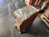 a small table that has a marble top on it