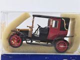 a red and black model of a car in a clear box