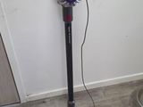 a vacuum that is sitting on the floor in the room