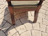 a chair that is sitting in the middle of a brick floor