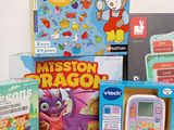 many children ' s toys and books on the table