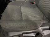 a dirty seat of a car that is in the back of the car