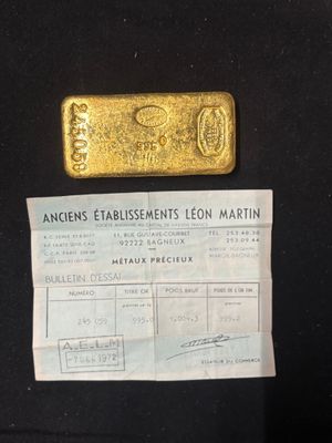 an image of a piece of gold sitting on top of a piece of paper